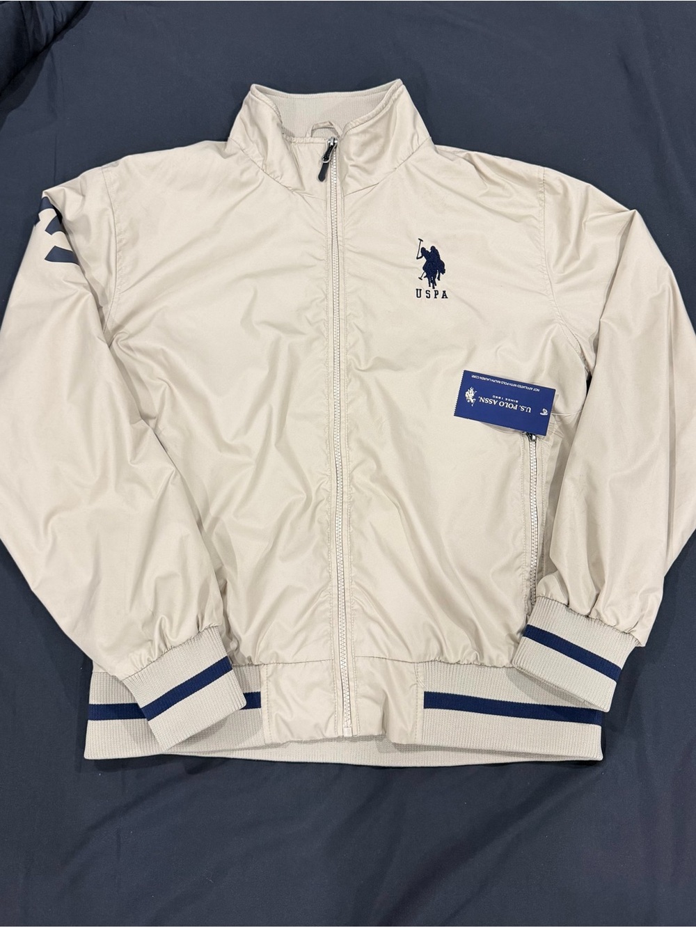 U.S. Polo Assn. Cream Bomber Jacket with Navy Trim